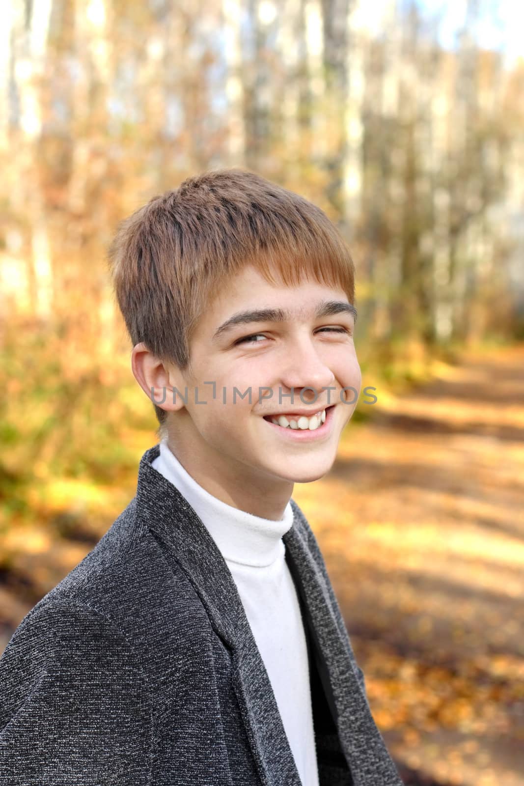 happy teenager portrait in the autumn park