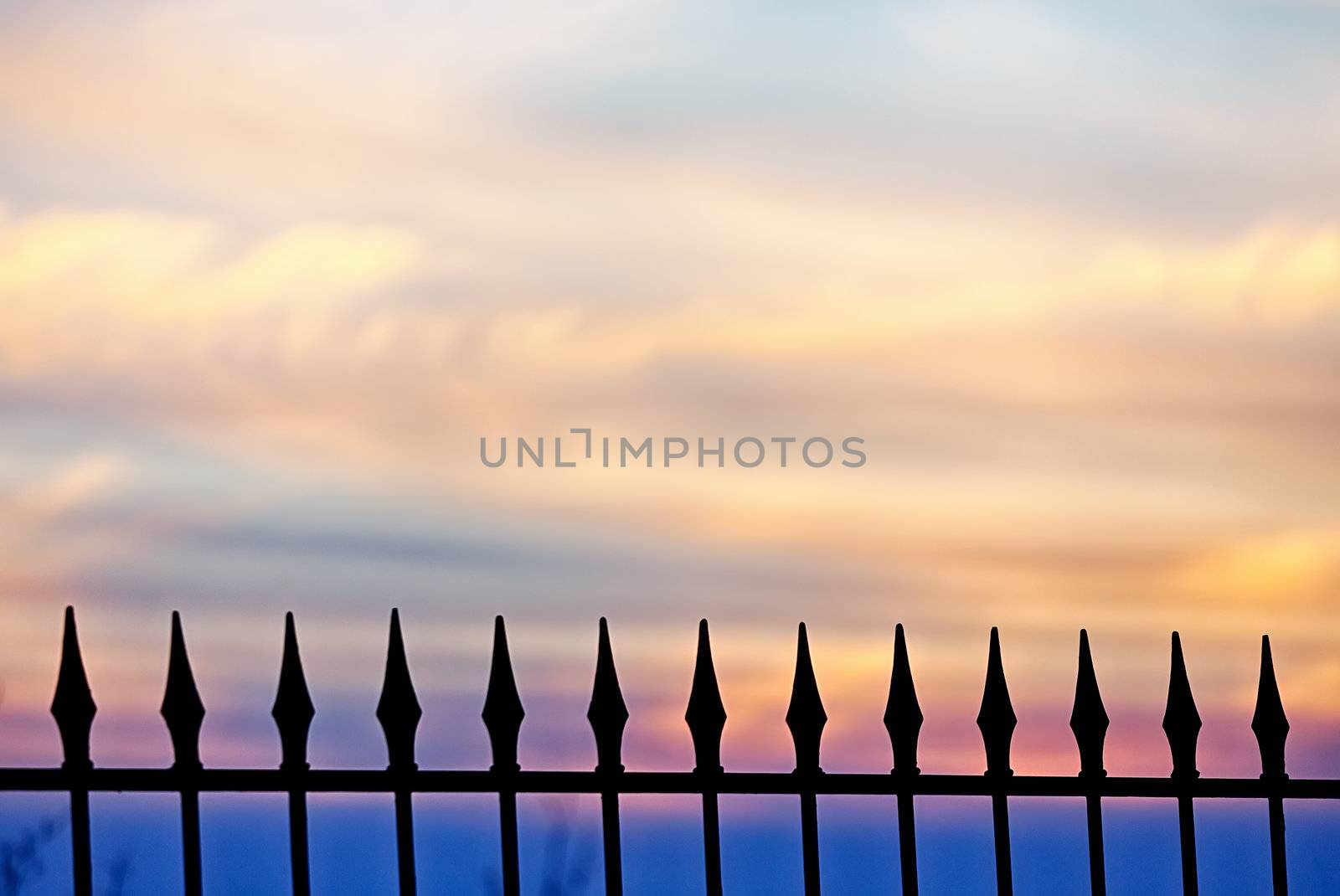 A fence against a golden sunset