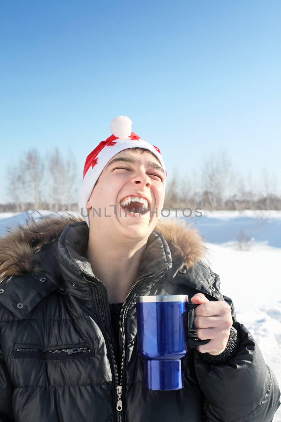 young man in santa hat by sabphoto