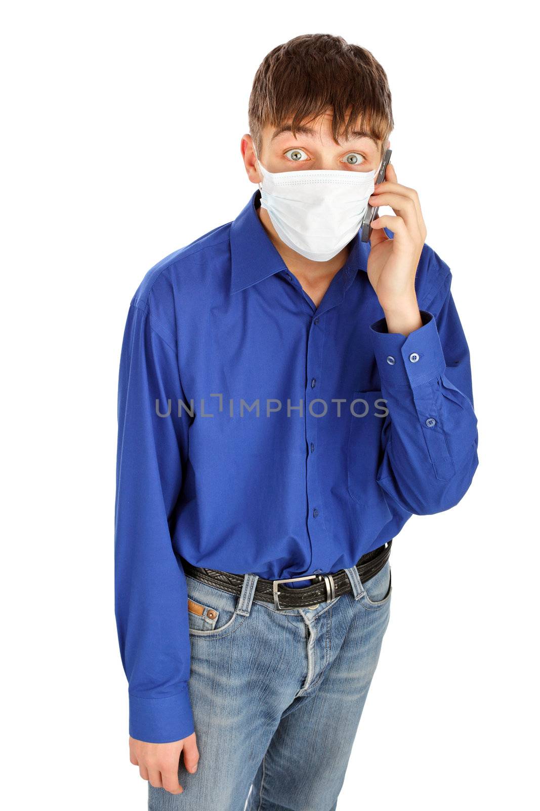 shocked teenager in flu mask with mobile phone. isolated on the white