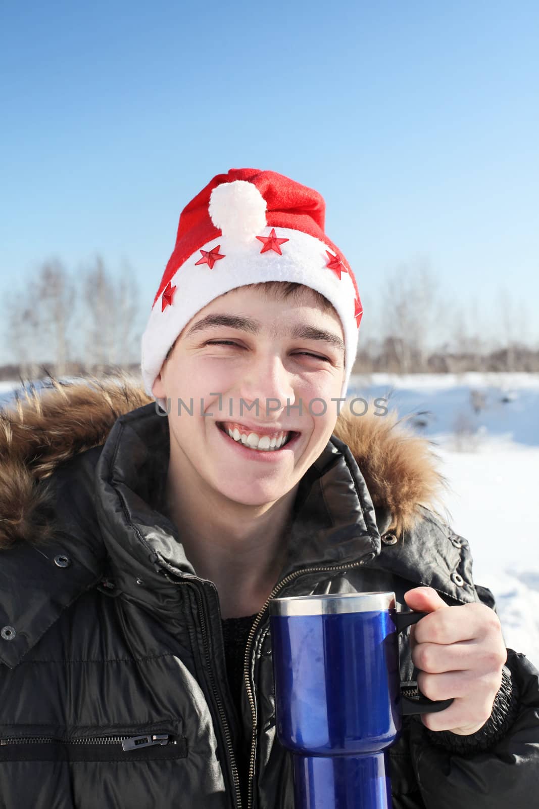 young man in santa hat by sabphoto