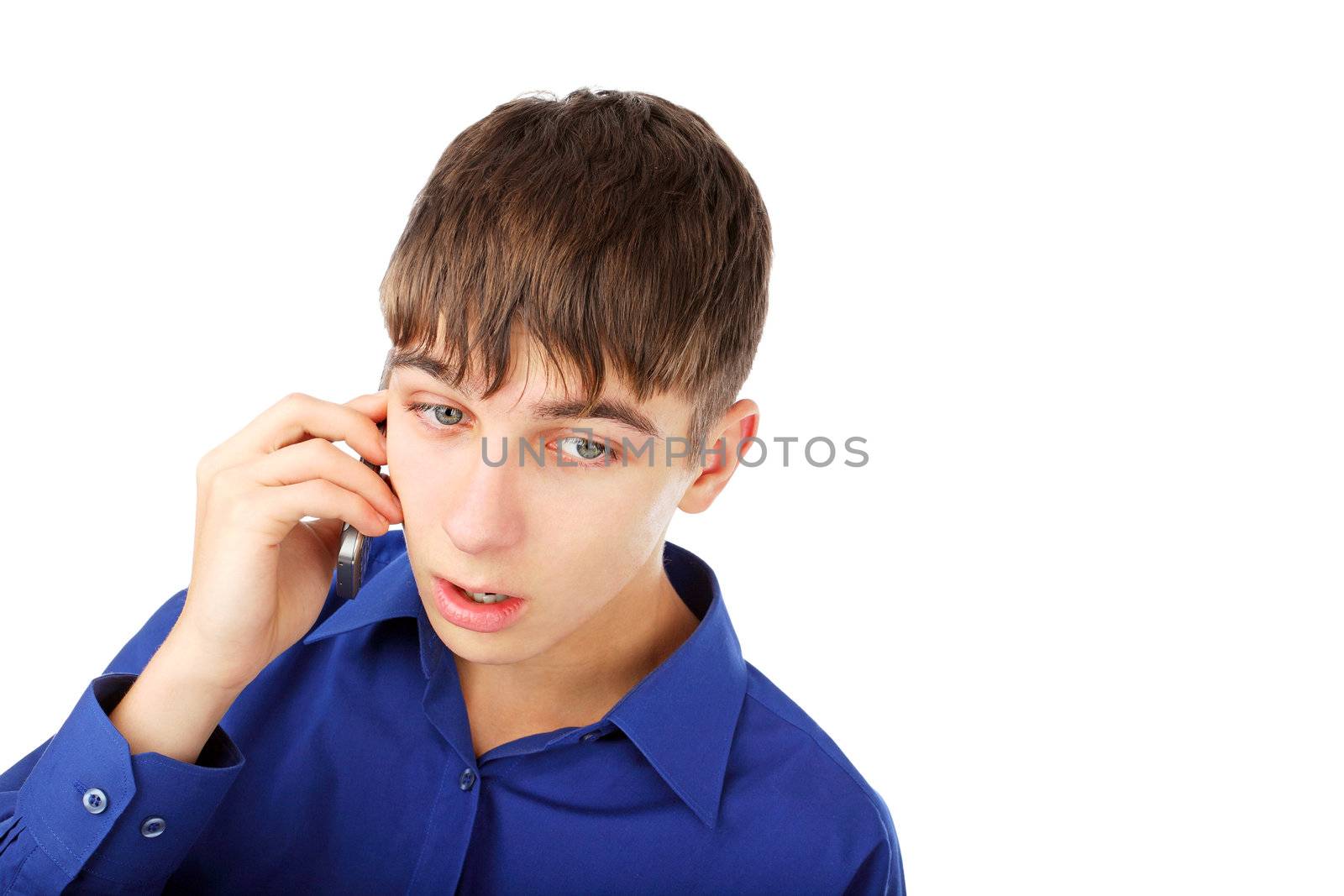 sad and frightened teenager with mobile phone on the white background