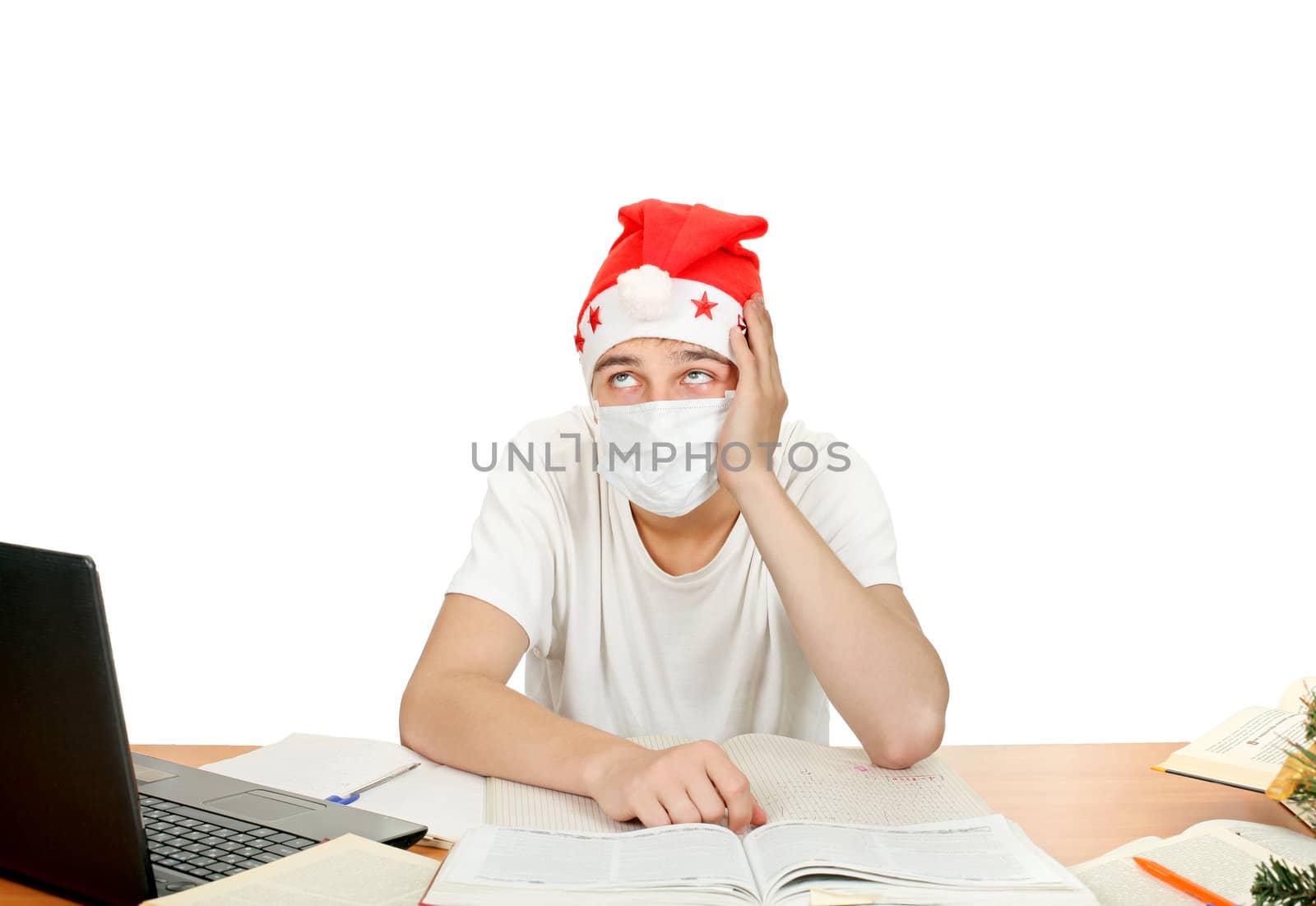 sick and sad student in santa's hat and flu mask.isolated on the white background