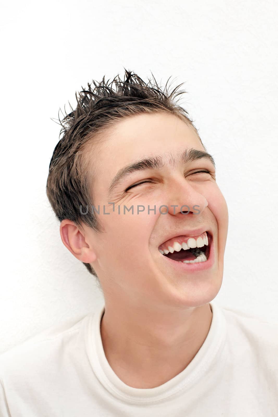 Young Man Laughing by sabphoto