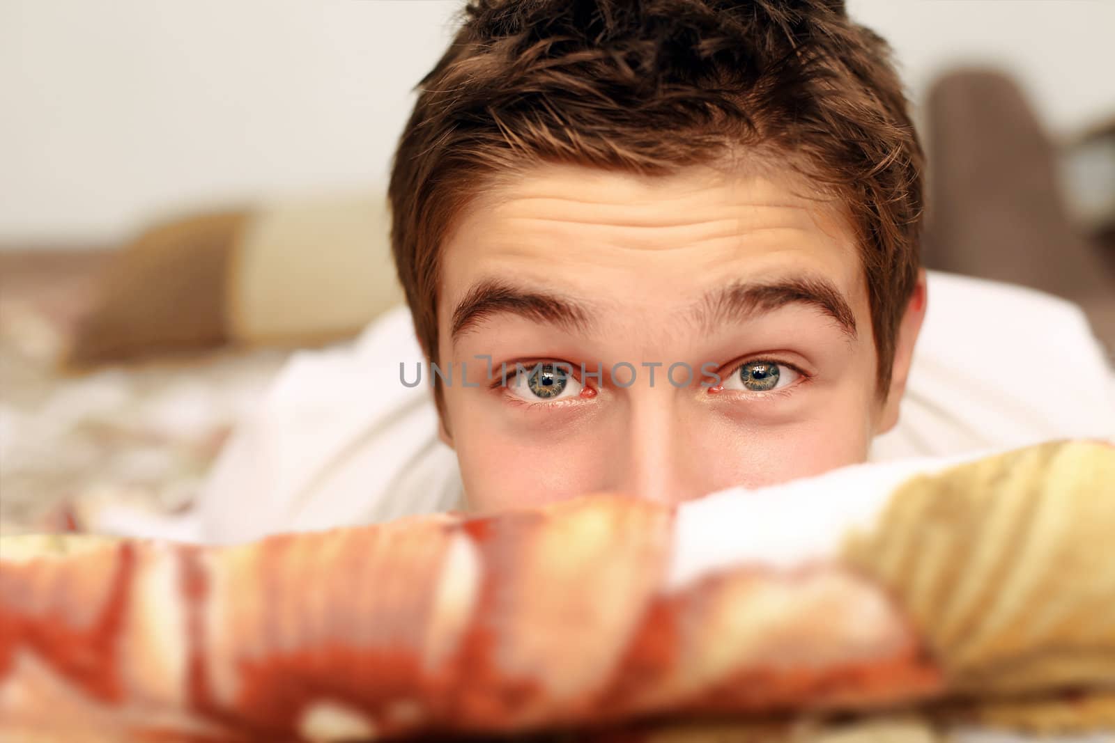 Young Man Portrait in the Bed closeup