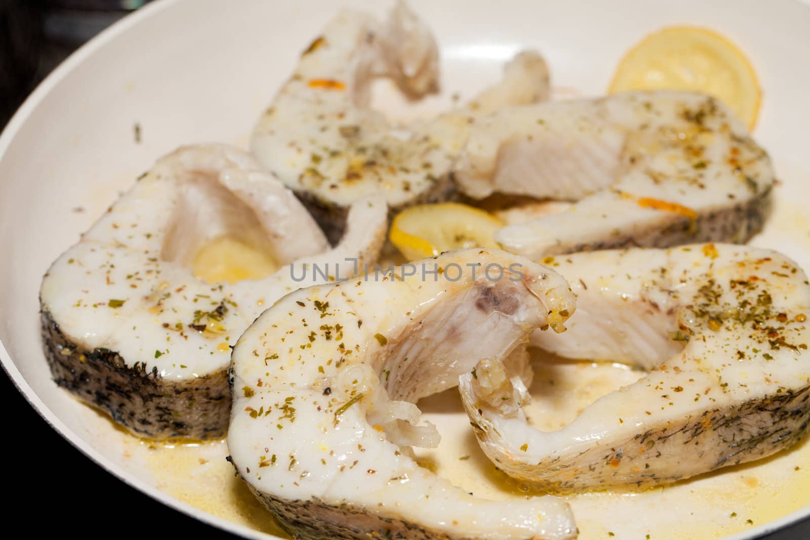 The fried fish on the frying pan
