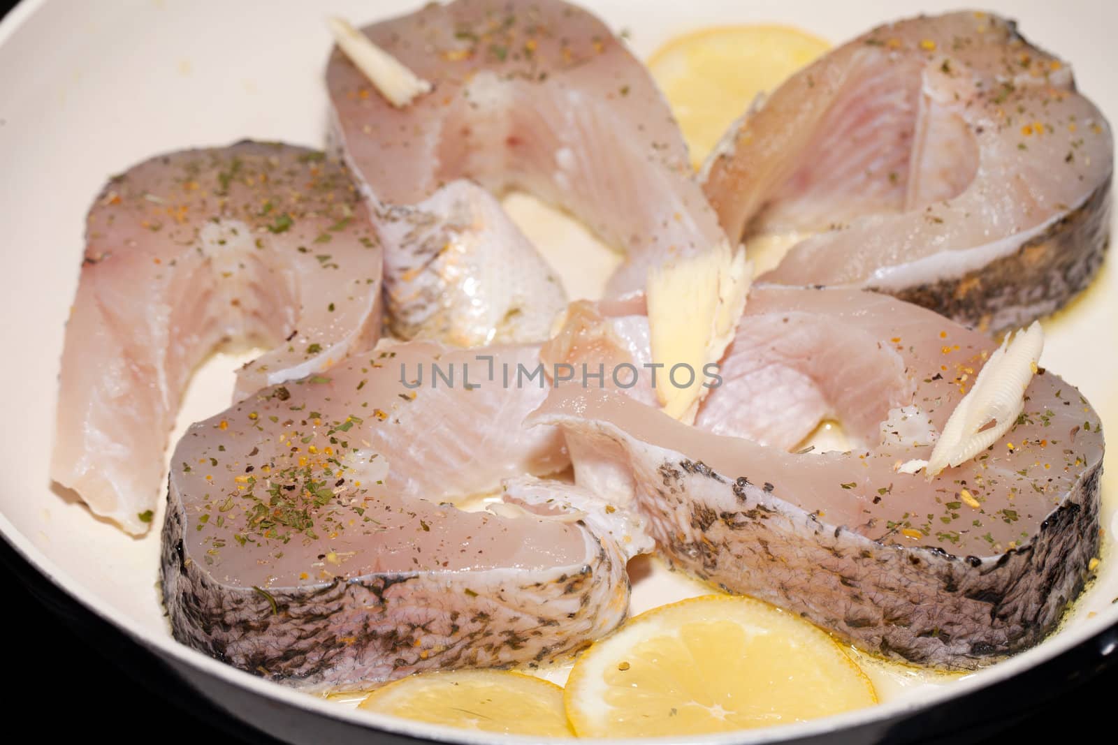 The fried fish on the frying pan