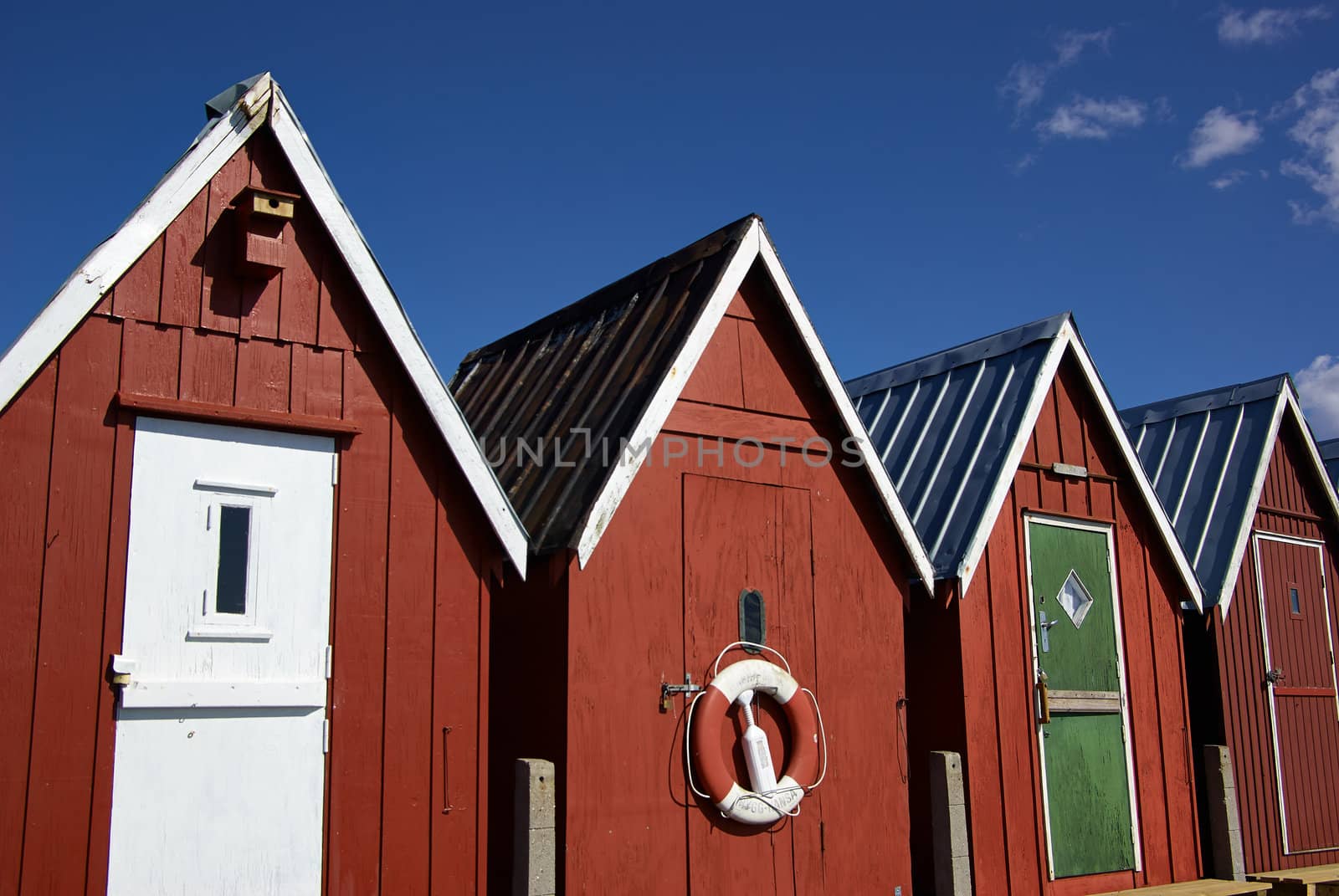 Beautiful red fishing huts on the coast Faaborg Denmark