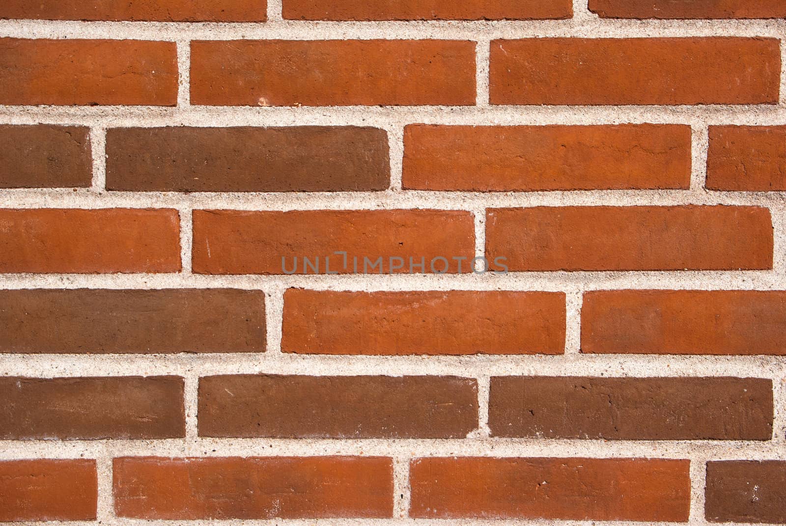 Background of new red brown brick wall texture in close view