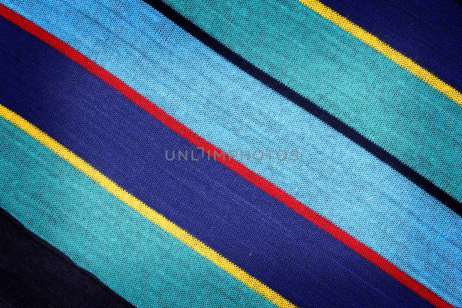 Fabric texture with diagonal color stripes. Close up