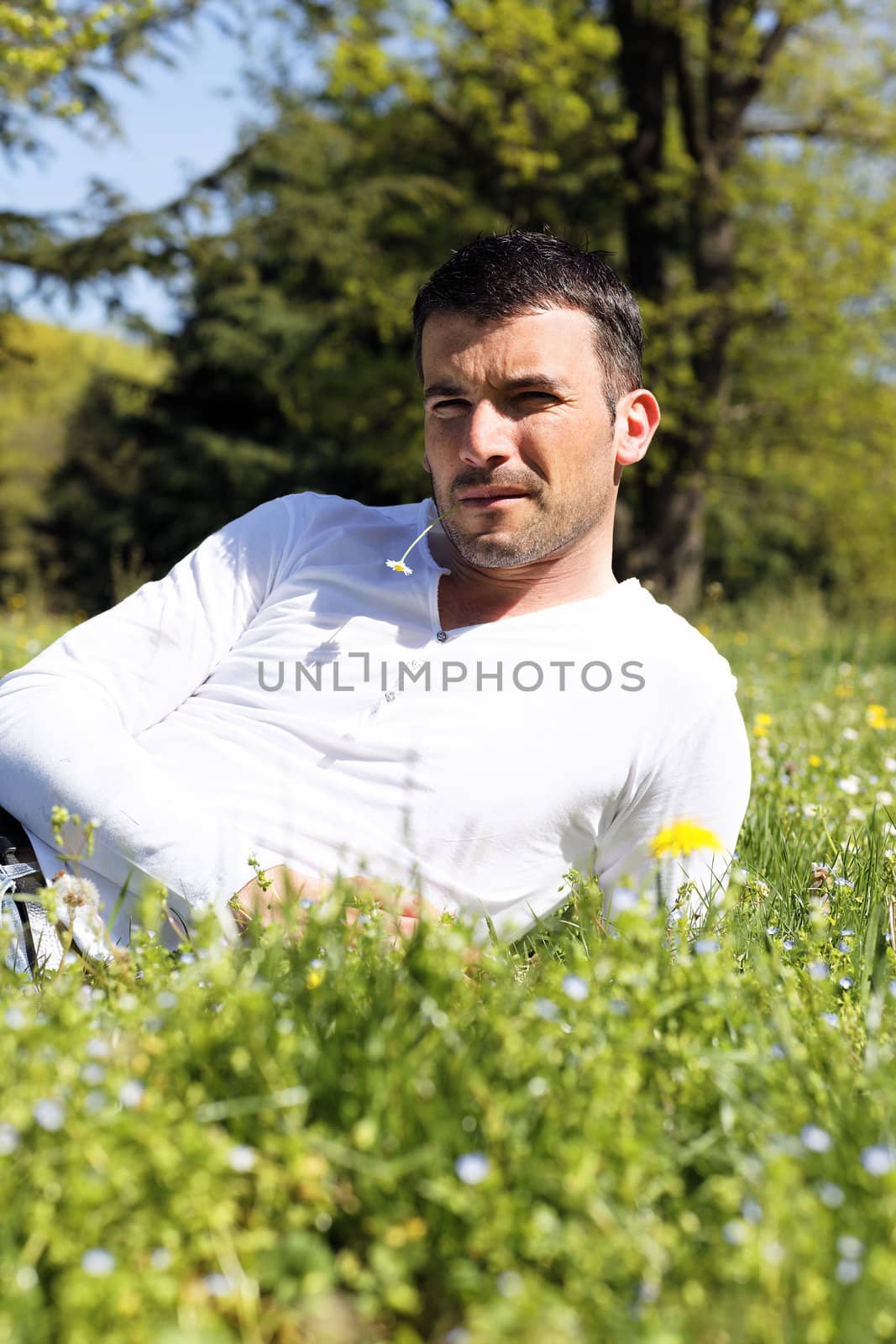 young man on the grass in a park