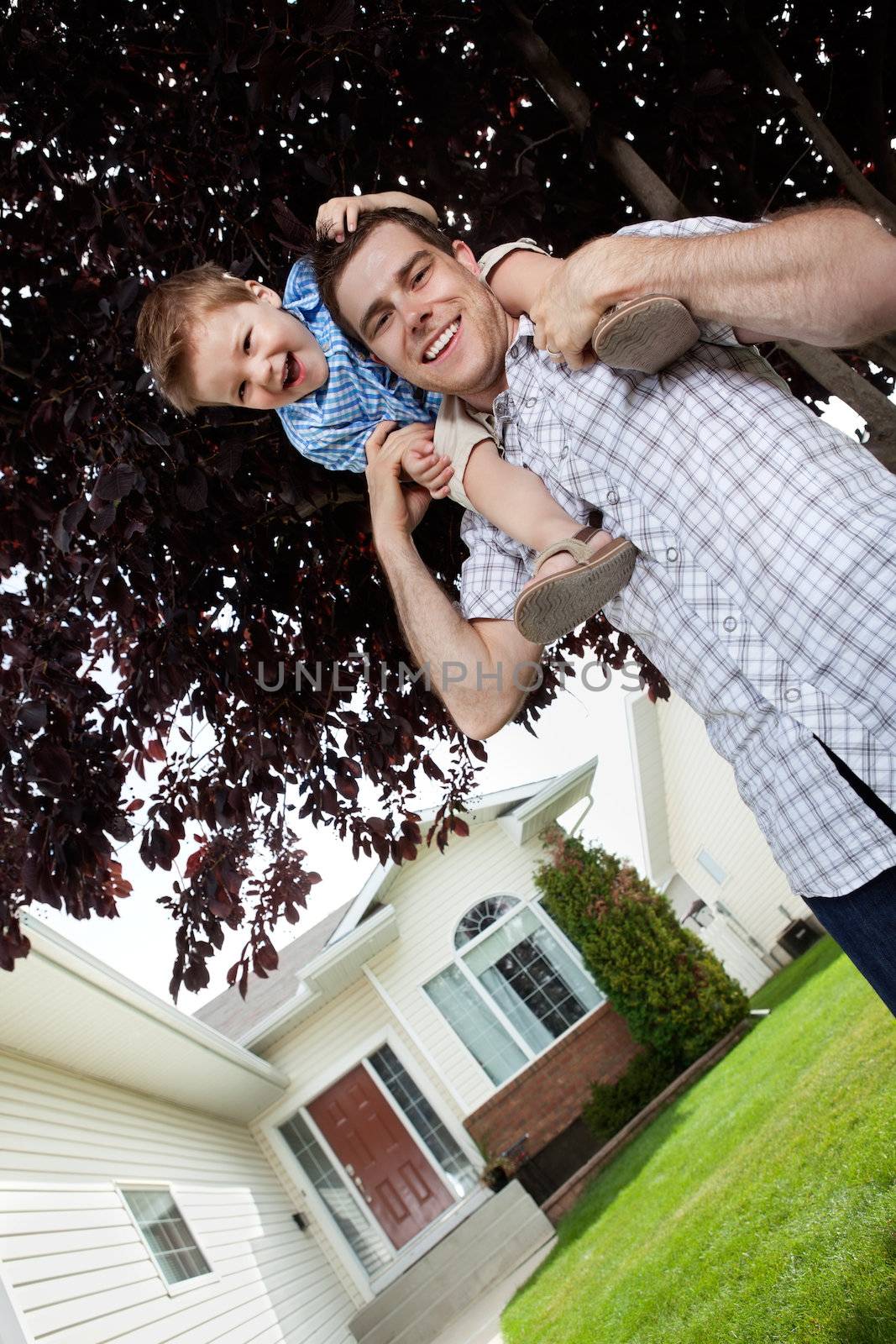 Son on his father's shoulders having fun