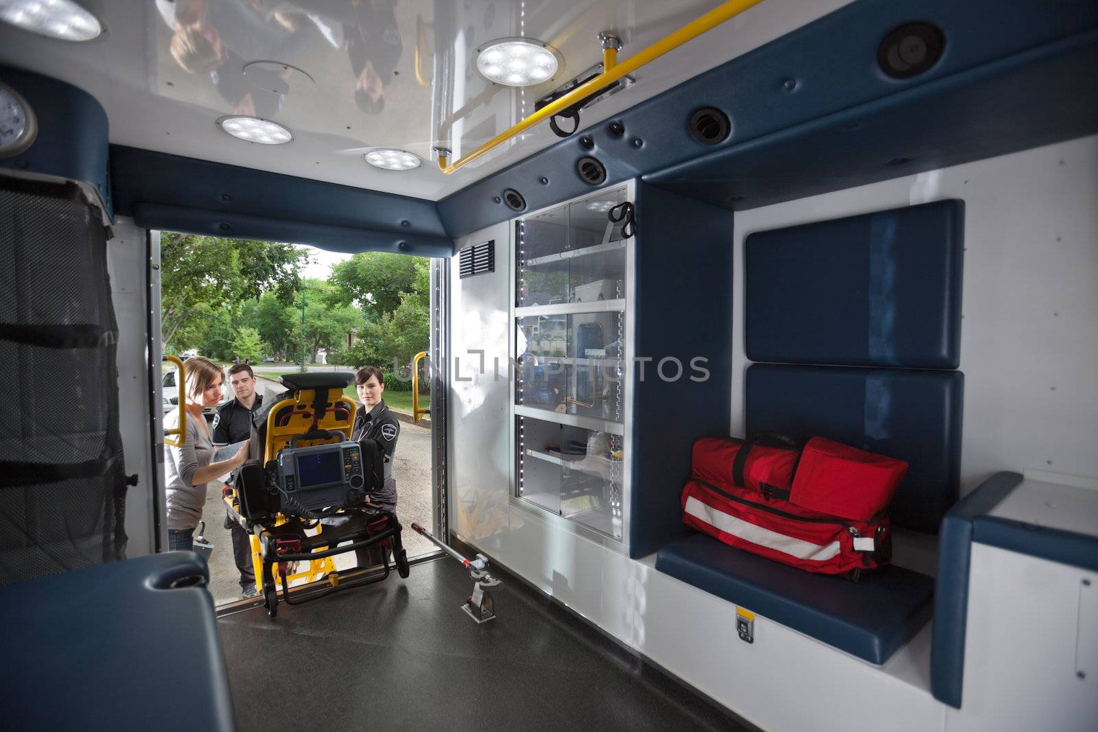 Interior of ambulance with stretcher being loaded
