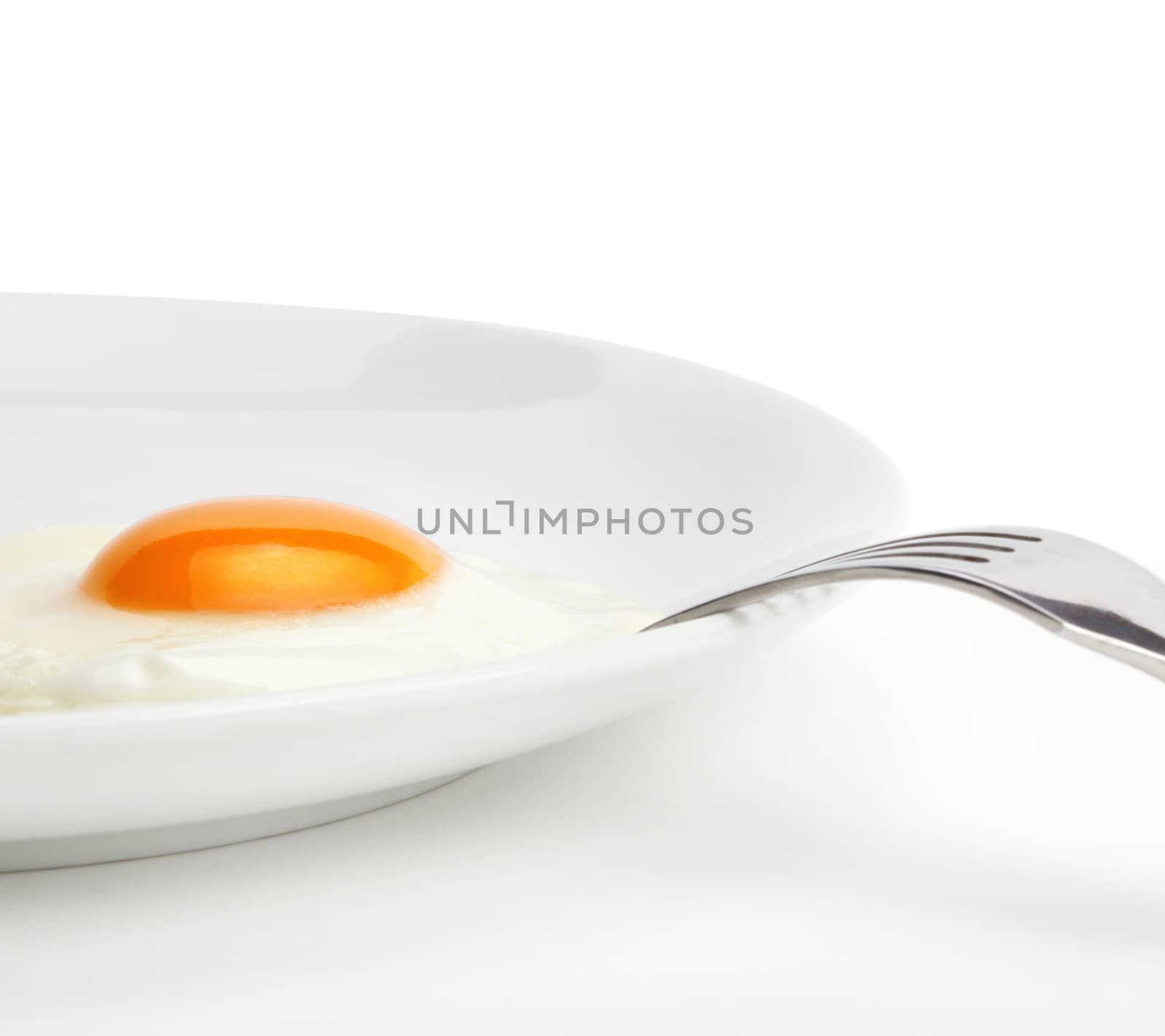 fried egg on plate by rudchenko