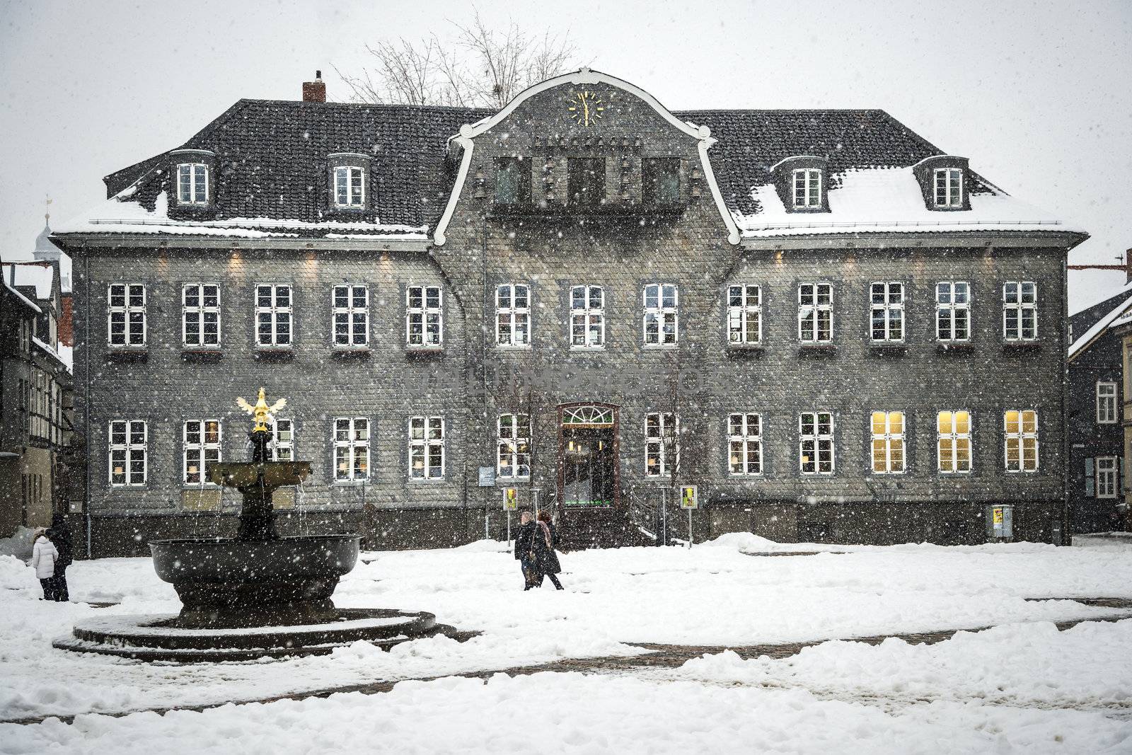 House with slate covered with snow in winter in Goslar, Germany