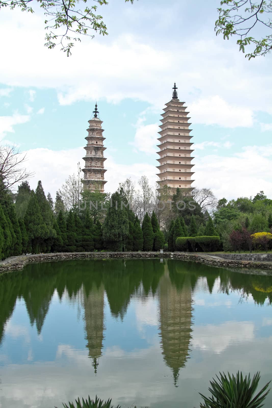 Three pagodas and water with reflection in Dali, China