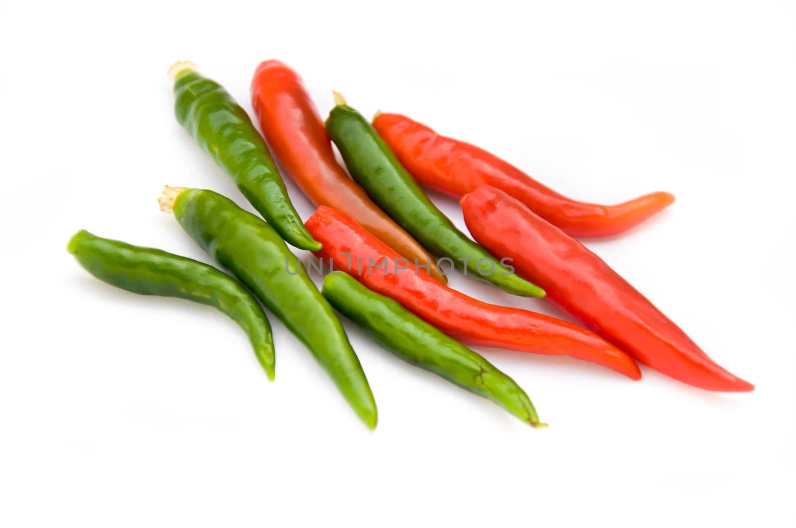 red and green chili on white background