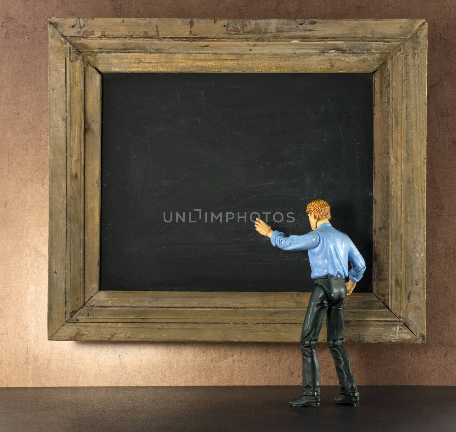Business person against the blackboard by compuinfoto