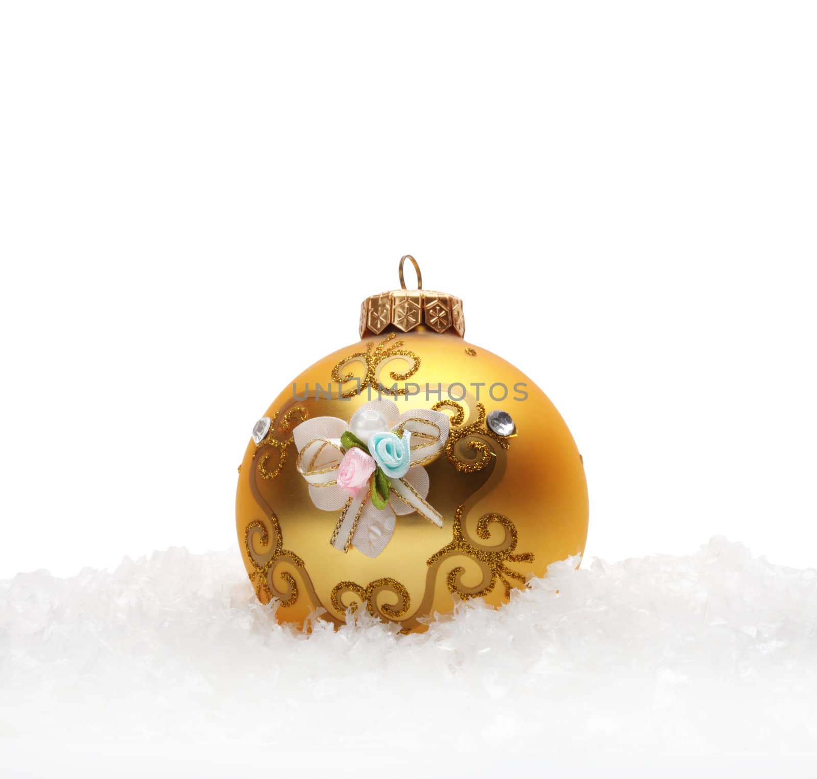 Gold Christmas balls in snow by rudchenko