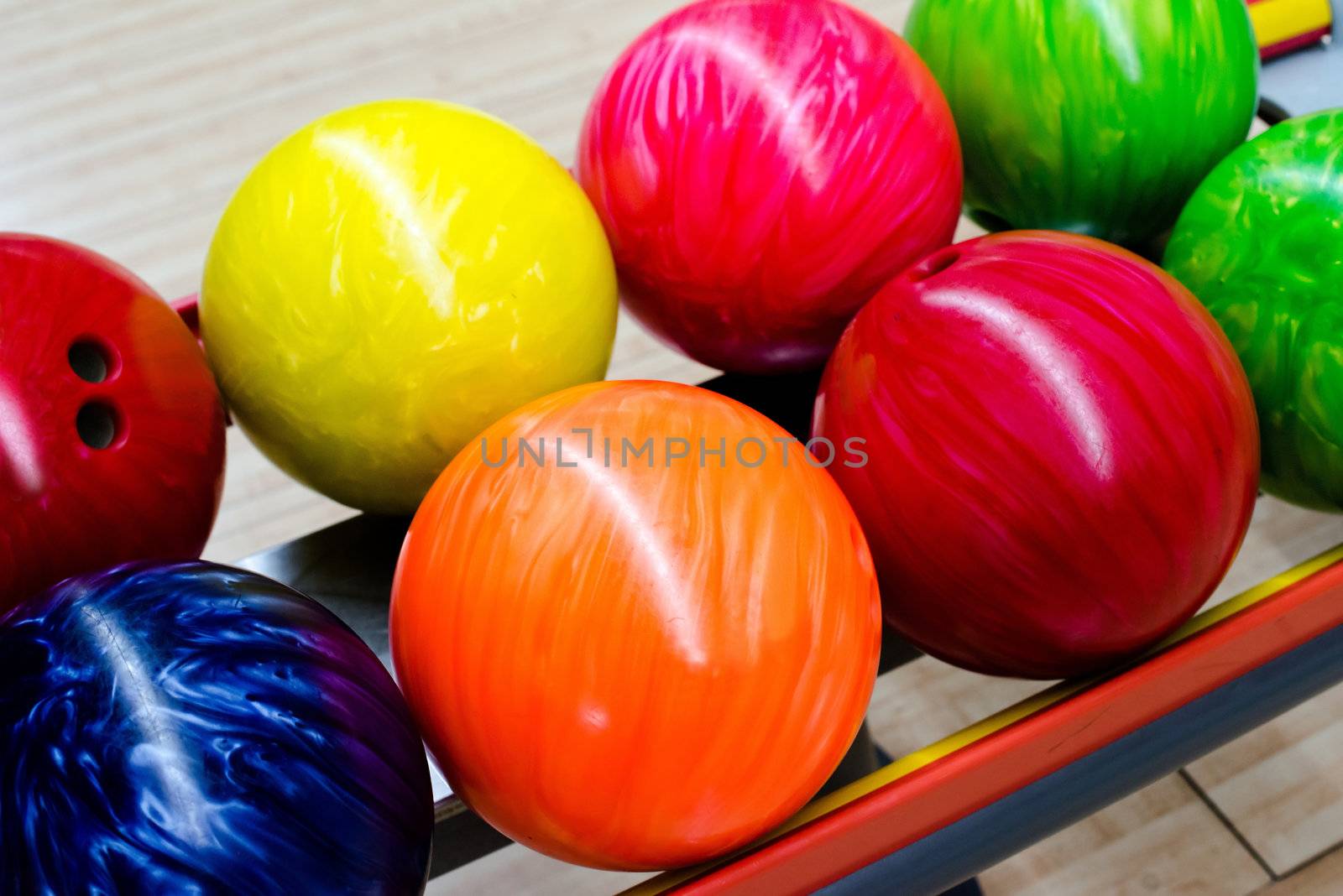 Colorful bowling balls waiting to be chosen