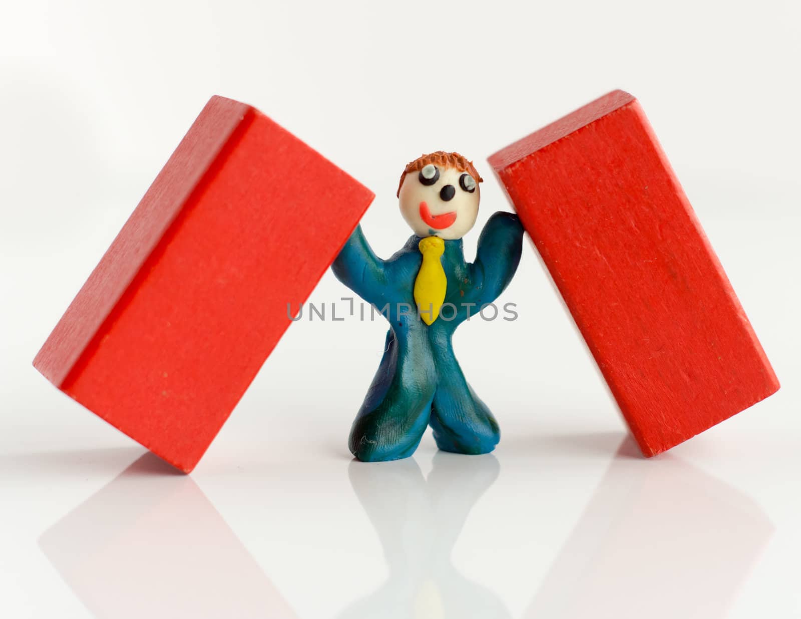 tired plasticine man with a calculator and a newspaper
