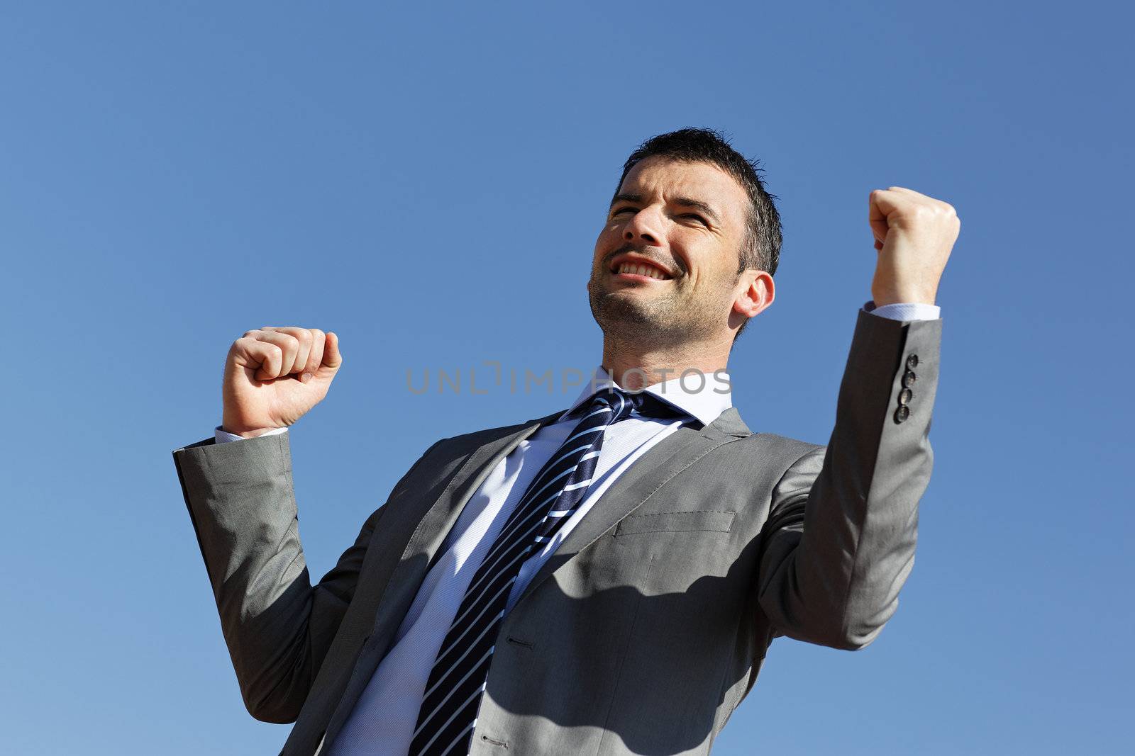 young businessman and blue sky in summer