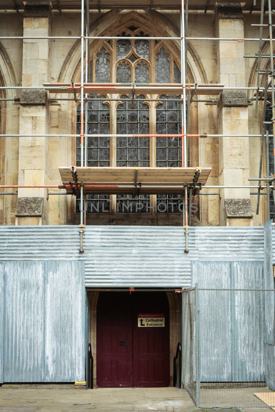 Scaffolding on a medieval english church undergoing repairs