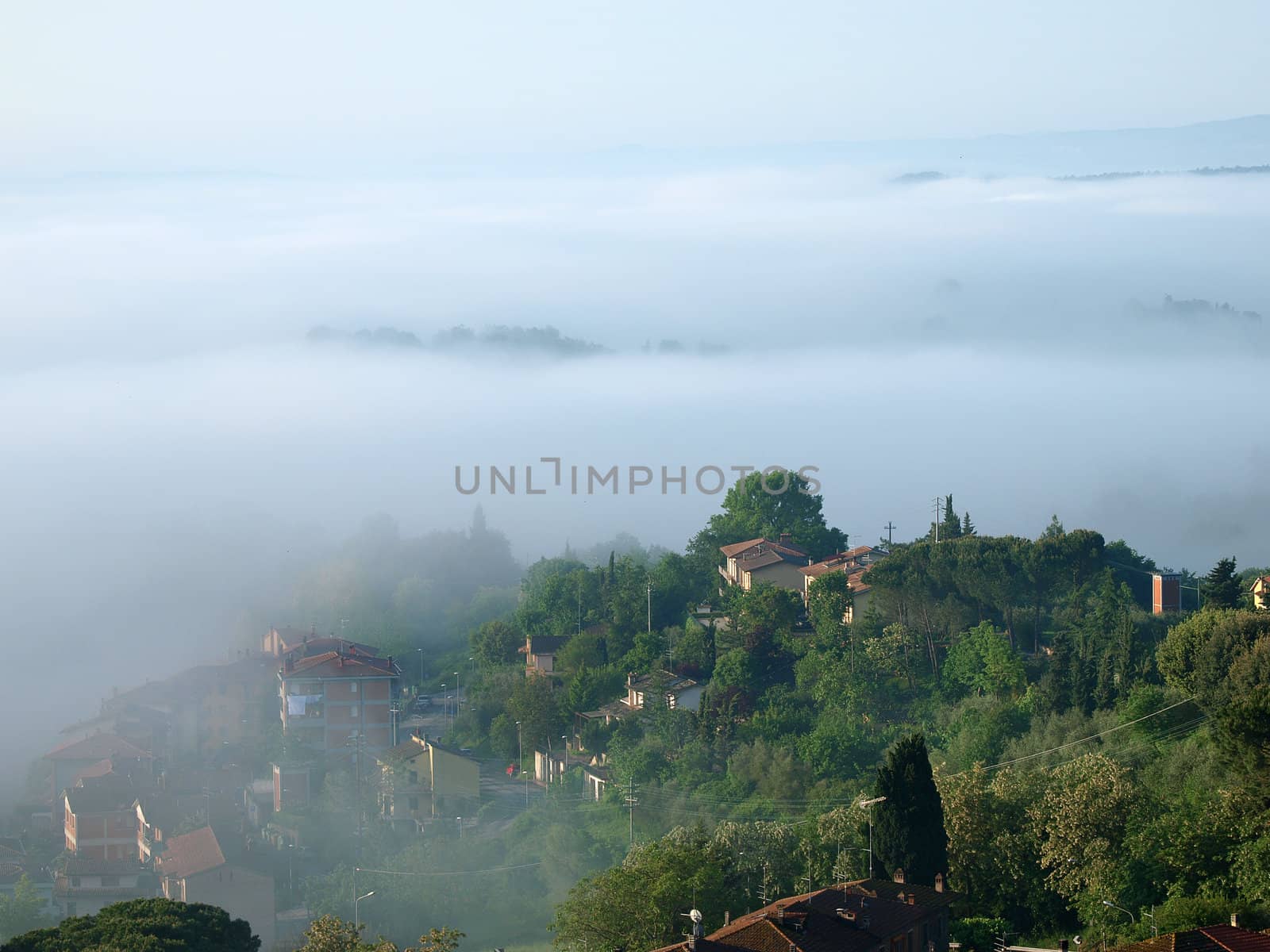 Fabulous landscape of the foggy morning in Tuscany. The valley between Montepulciano and Chiusi