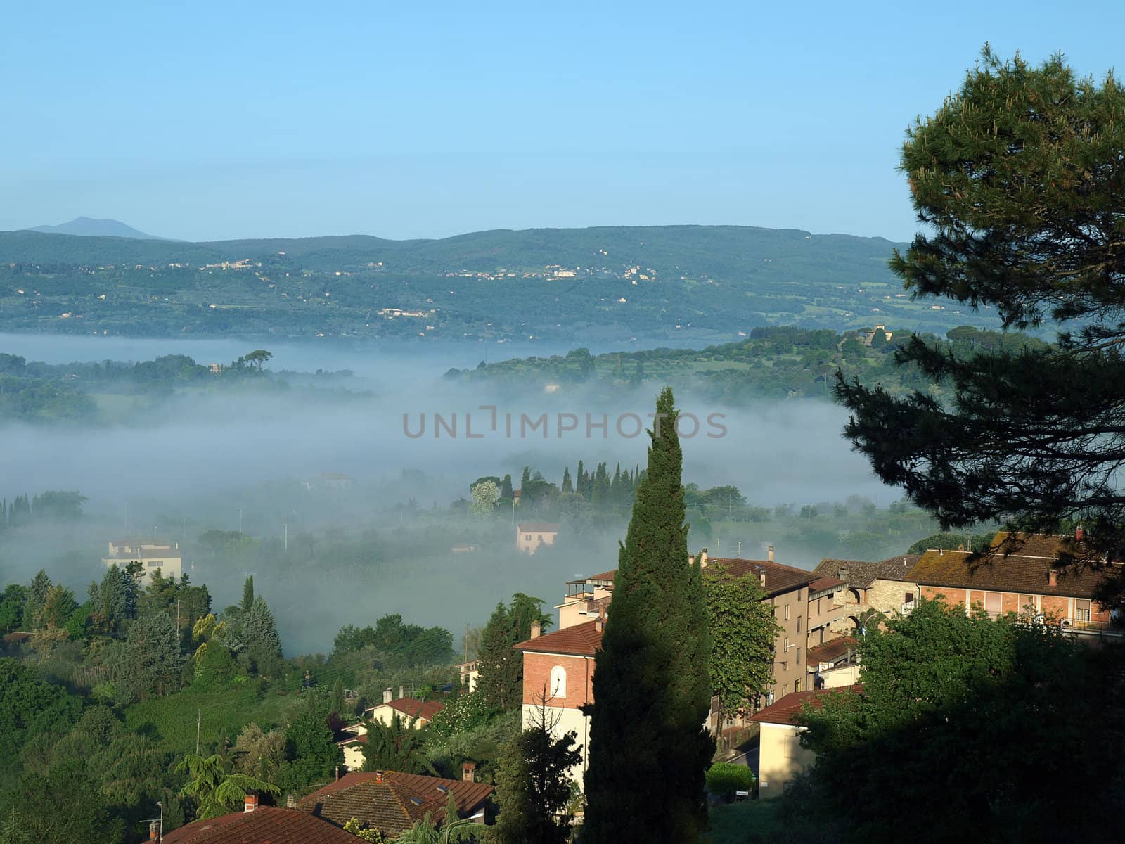 Fabulous landscape of the foggy morning in Tuscany. The valley between Montepulciano and Chiusi