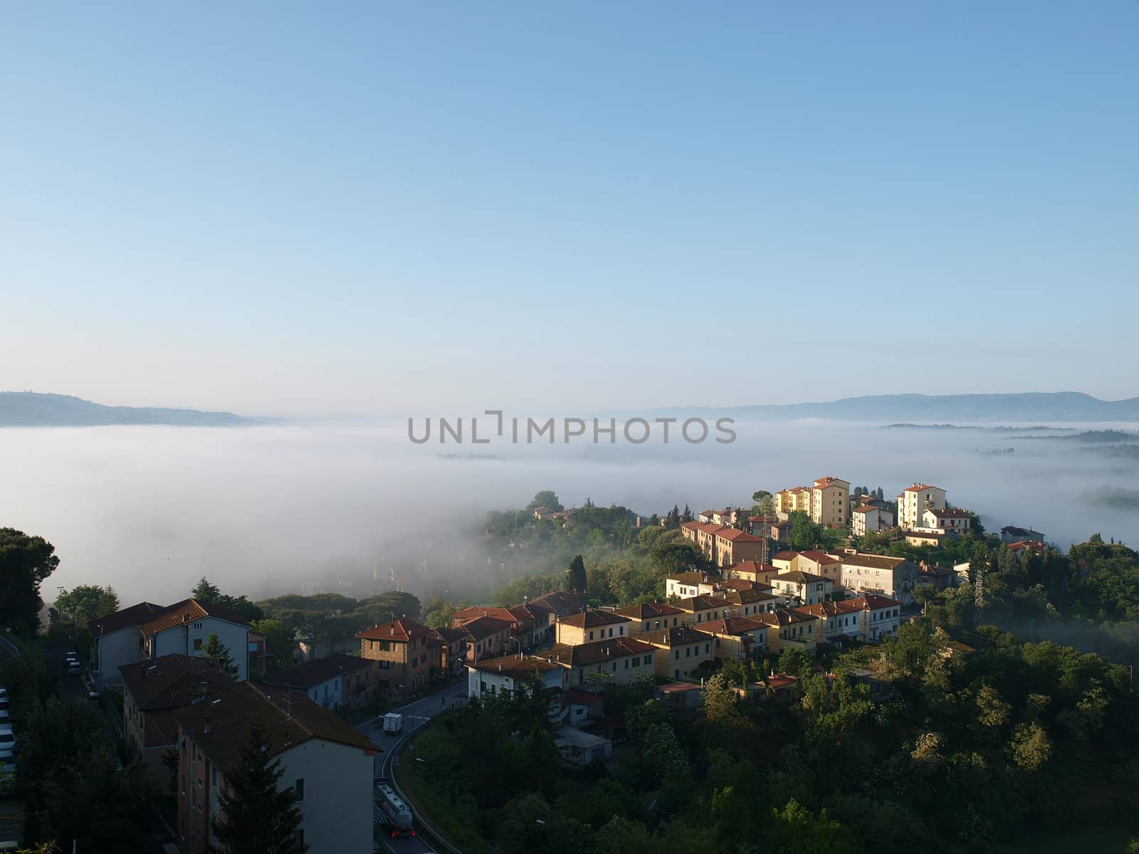 Fabulous landscape of the foggy morning in Tuscany. The valley between Montepulciano and Chiusi