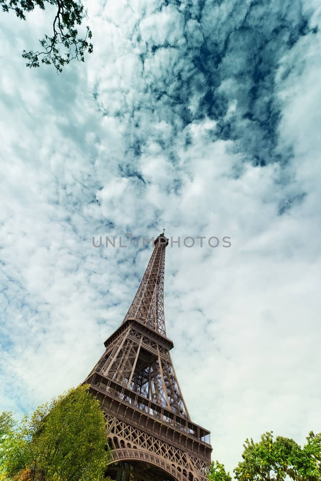 Eiffel Tower against the blue sky and clouds. Paris. France.