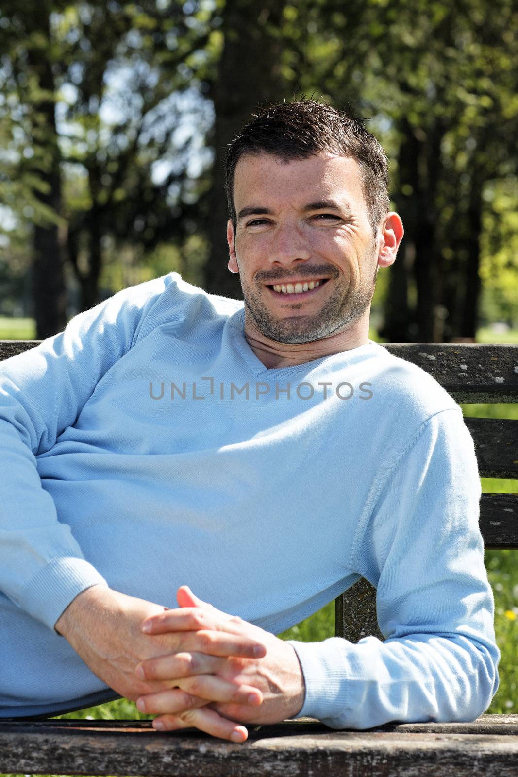 happy man on a bench
