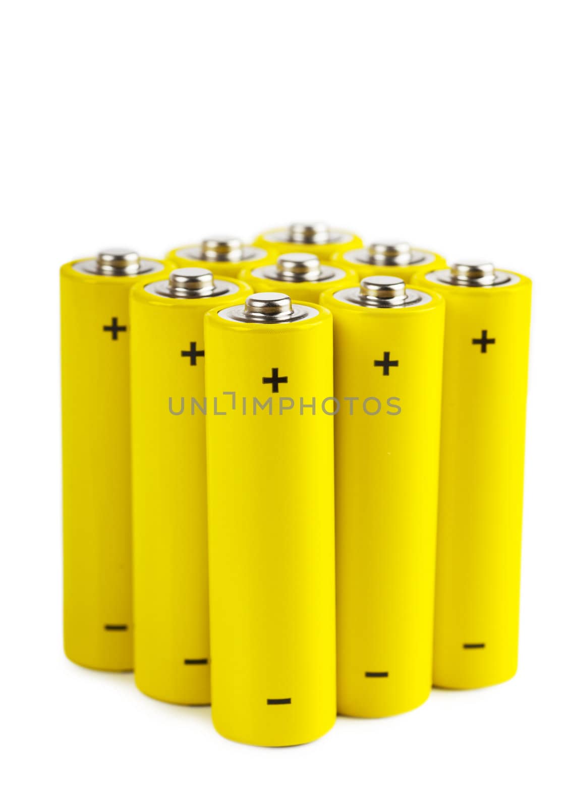 Bunch of yellow batteries isolated over white background