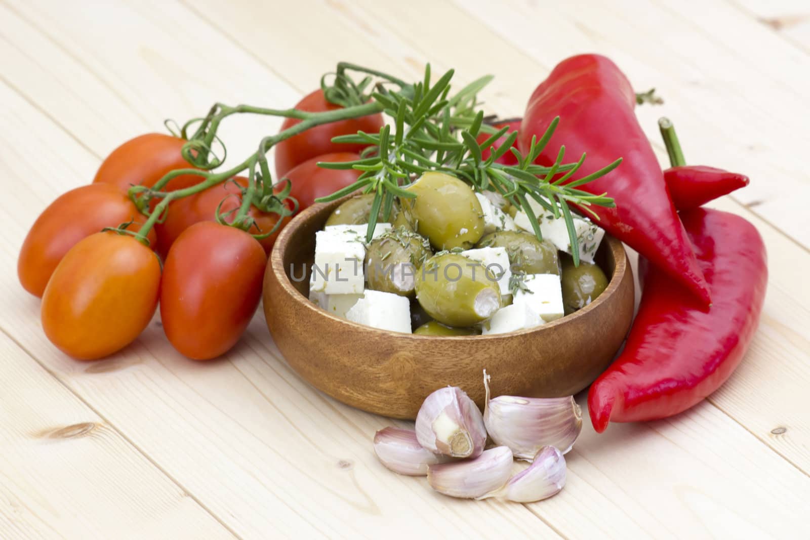 feta cheese with olives, tomatoes, peppers, garlic and herbs