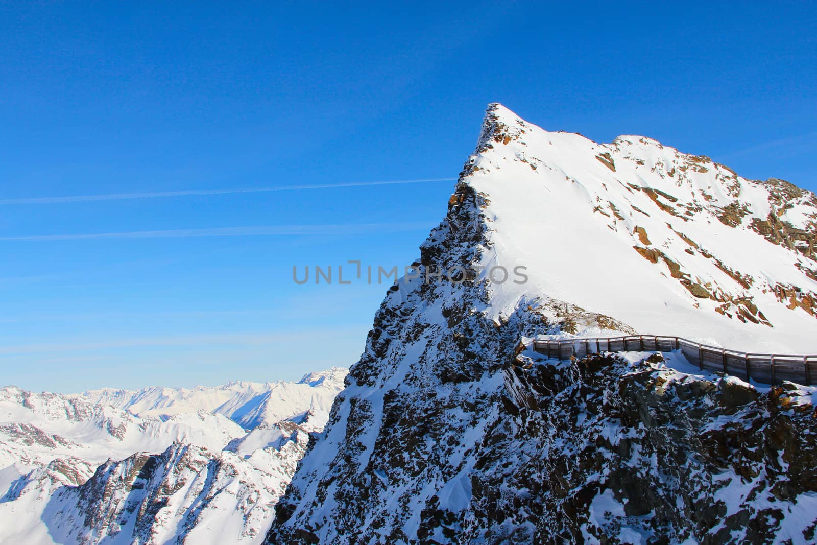 High mountains under blue sky beautiful winter panorama