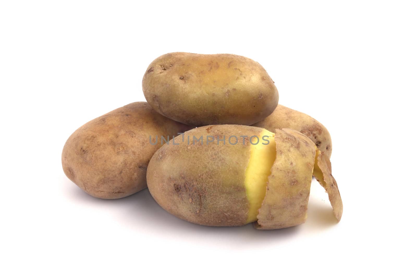Peeled fresh potato close up isolated on white
