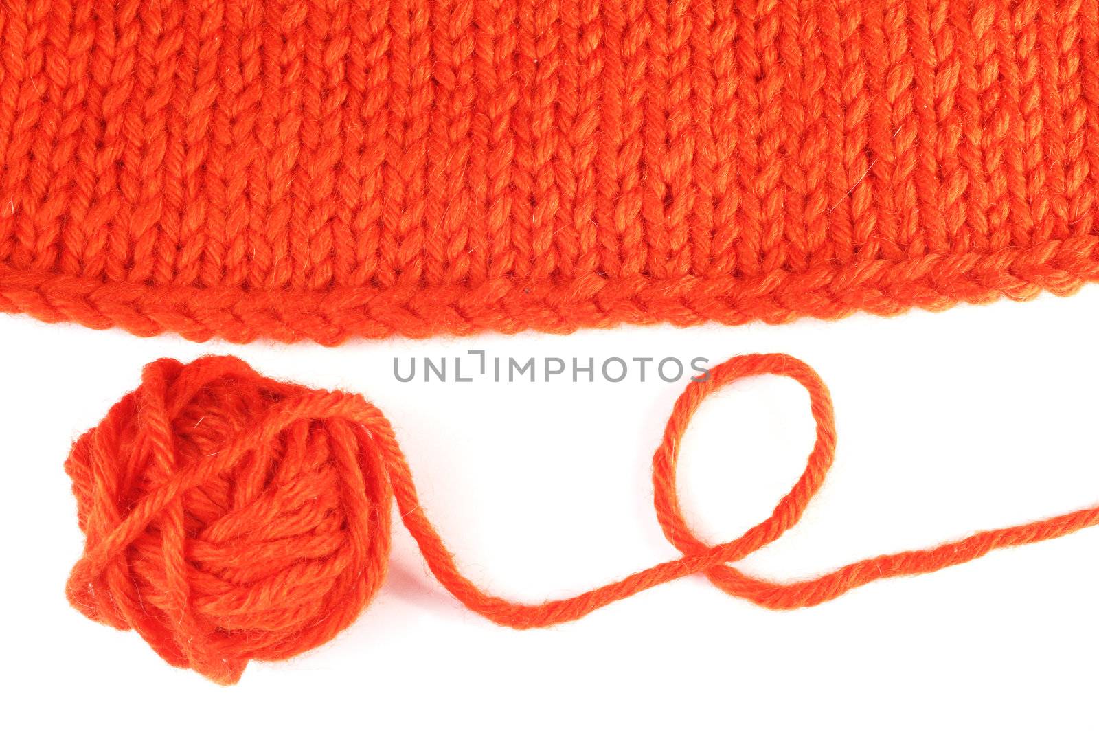 Wool yarn and knitted textile isolated on white background