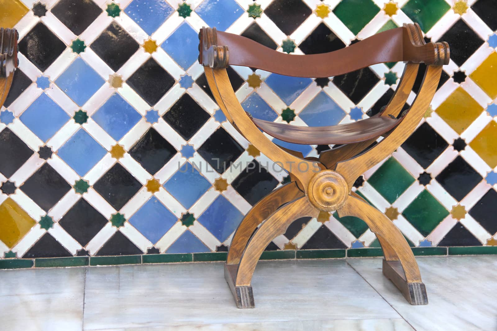 Empty seat in arabic palace of Alhambra by destillat