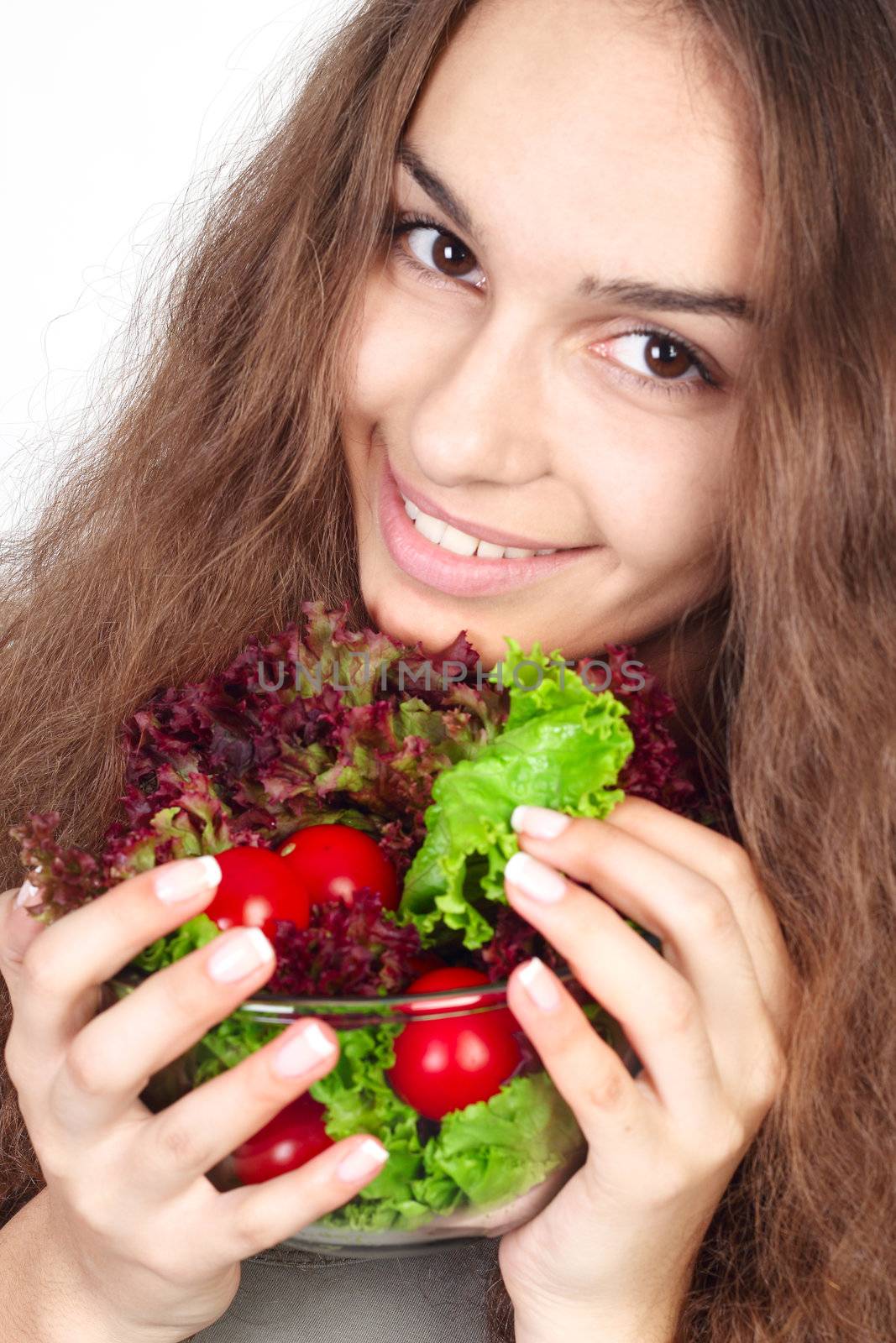 Young woman holding bowl of salad close-up portrait