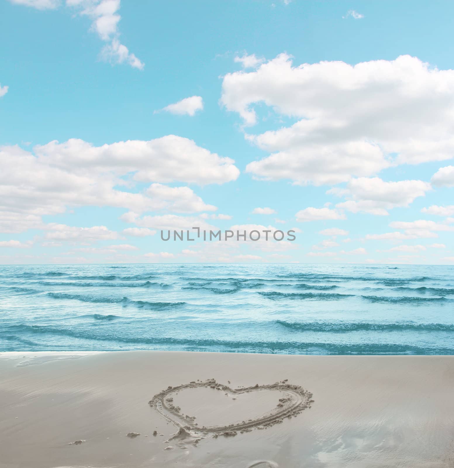 Symbol of heart drawn on sand of sea shore