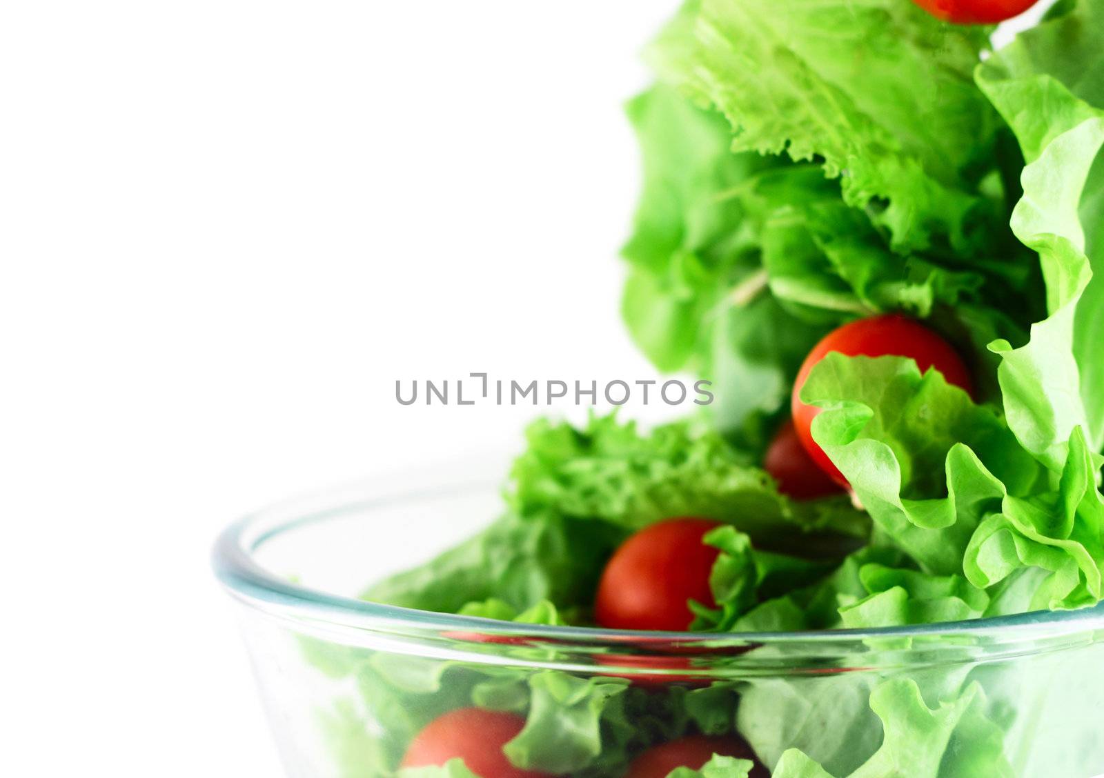  Light lettuce and cherry tomatoes salad close-up isolated on white lightness concept