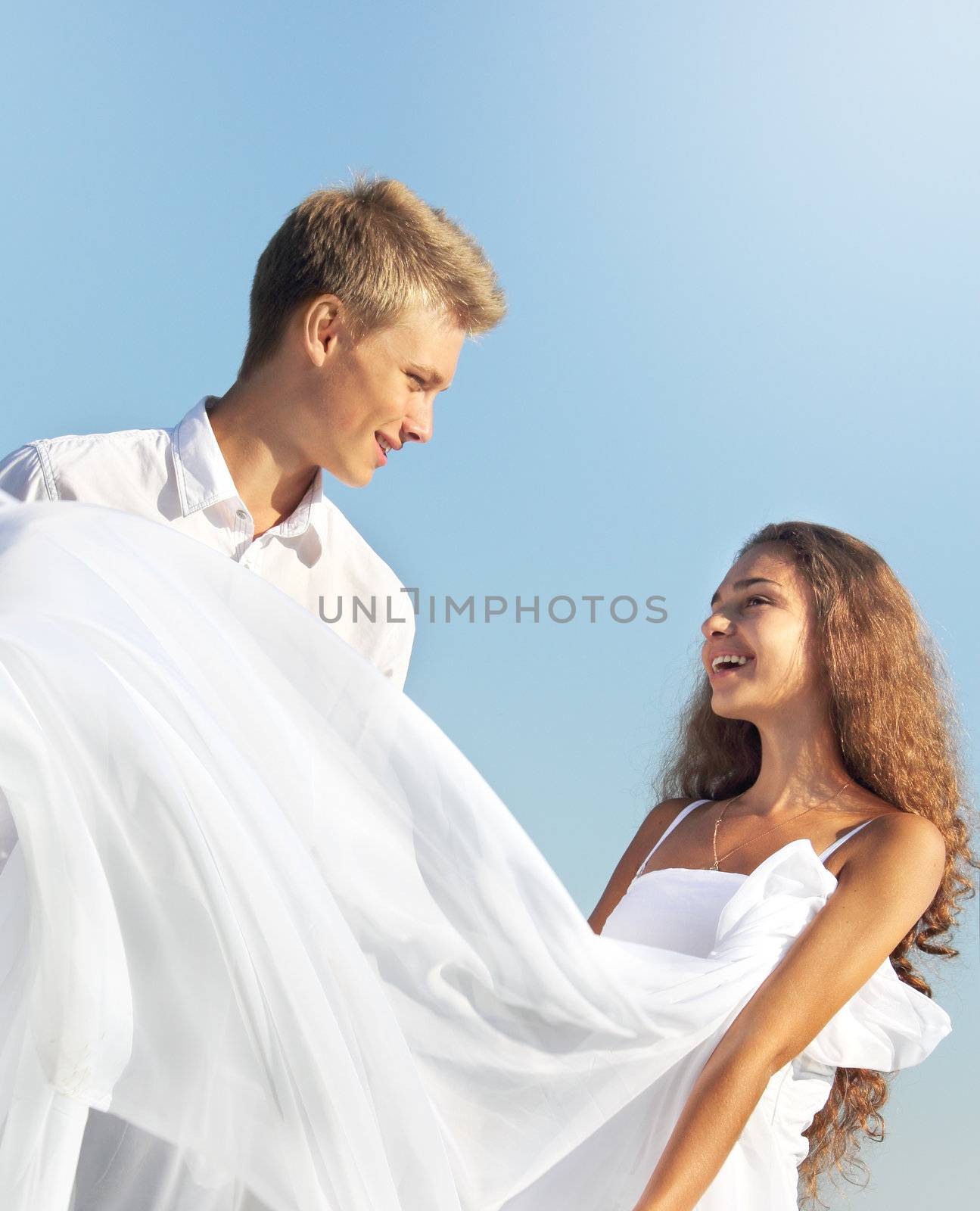 Romantic couple outdoors at sunny summer day