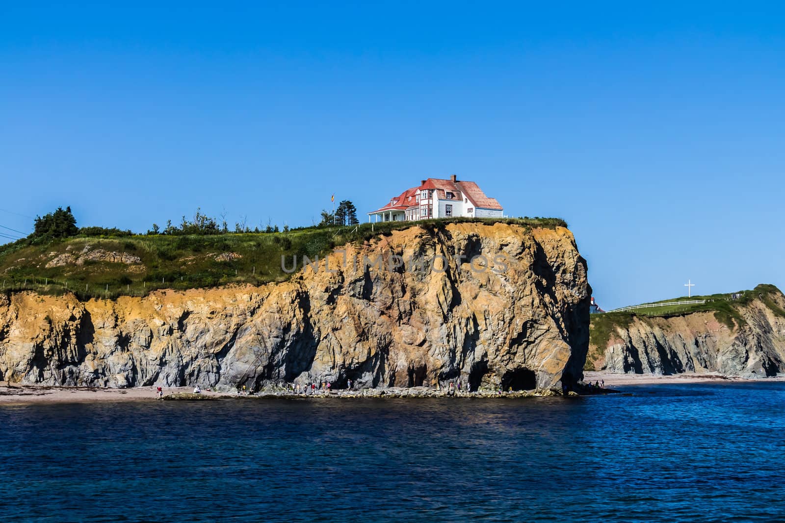 A house on the coast of Saint Lawrence river in a sunny day in Gaspesie, Quebec, Canada