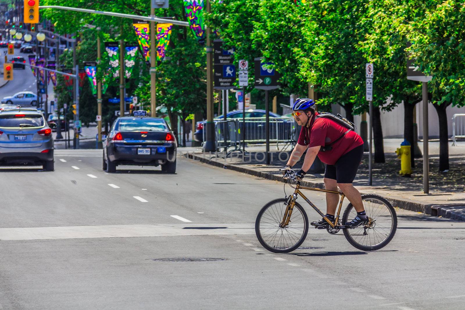 A bicyclist in Ottawa by petkolophoto