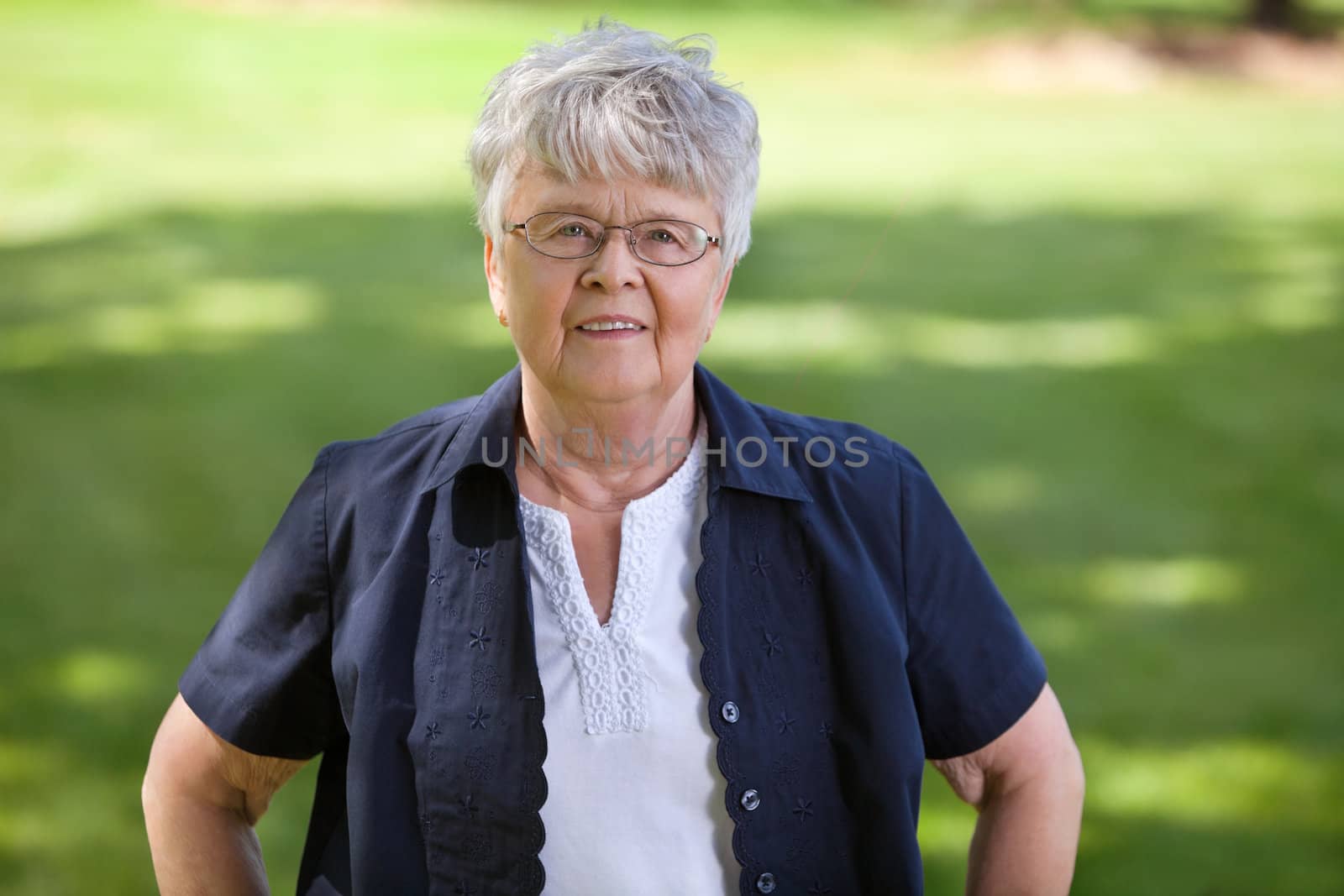 Portrait of senior woman standing in park