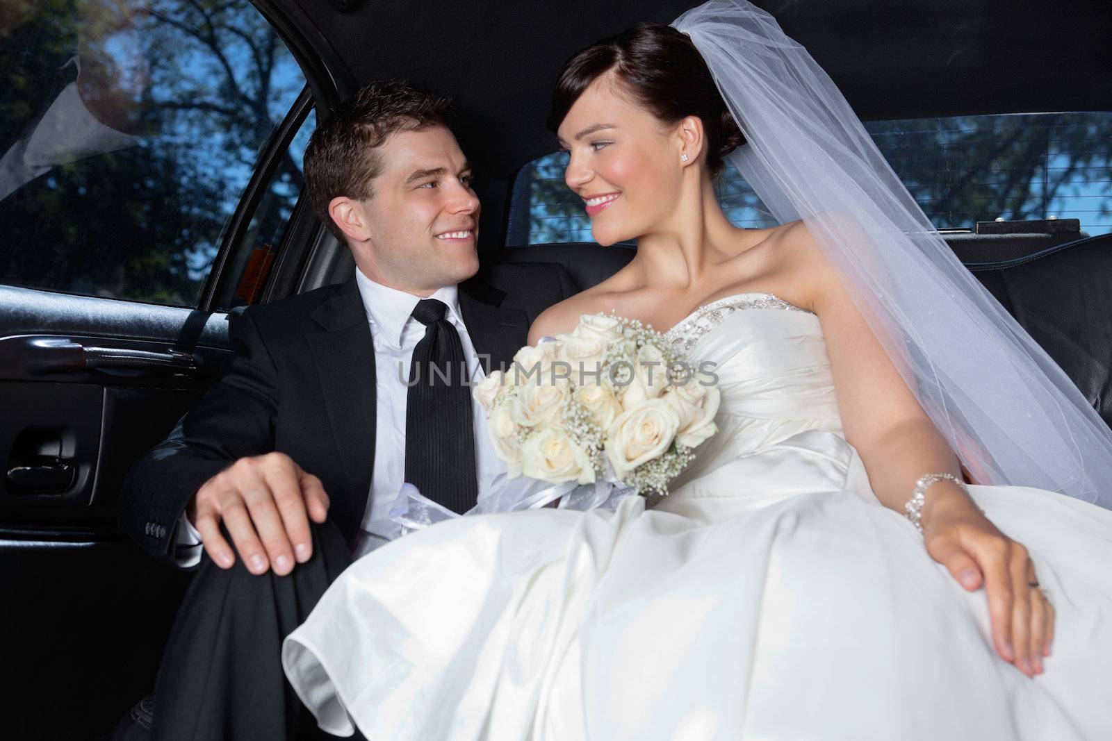 Couple in a luxurious car by leaf