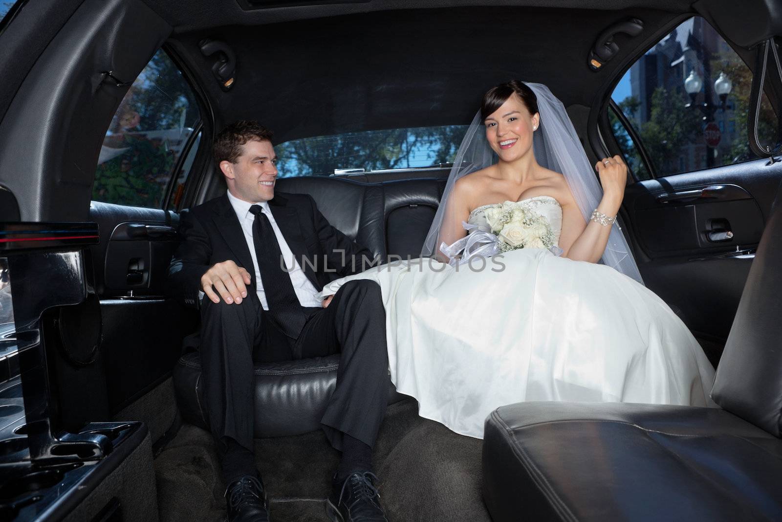 Newlywed in a luxury wedding limousine