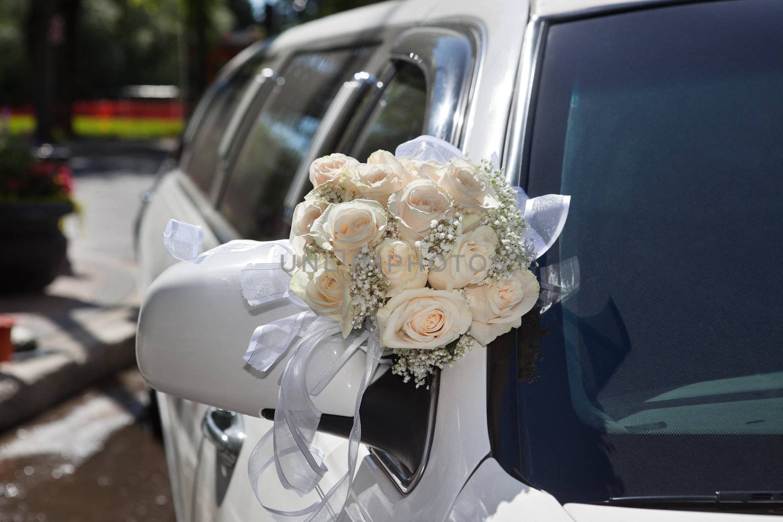 Wedding car decorated with flower bouquet