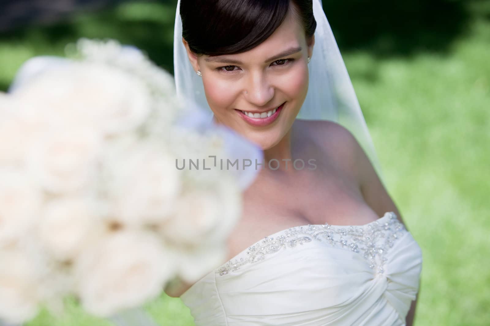 Attractive Bride Showing Off Her Flower Bouquet.