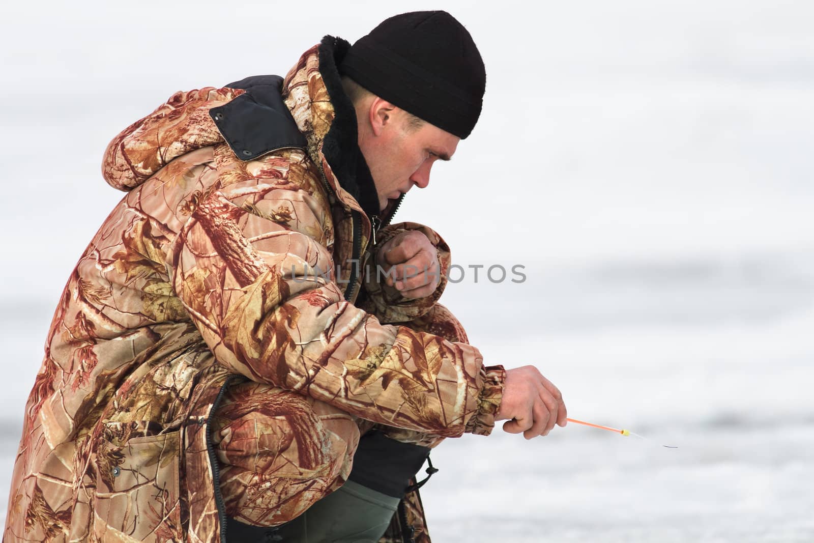 The fisherman on winter fishing